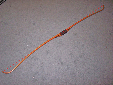 Static recurve ended 66” Ben Pearson bow with 2 ½” of set. All such bows in my collection had similar or worse amounts of set shown by the red line.